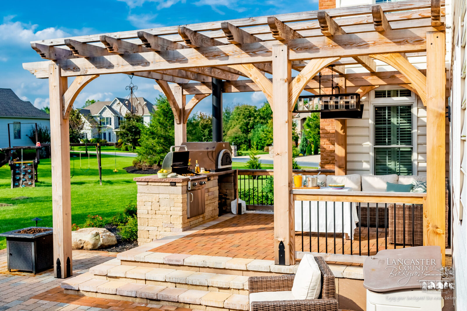 beautiful outdoor kitchen under a pergola