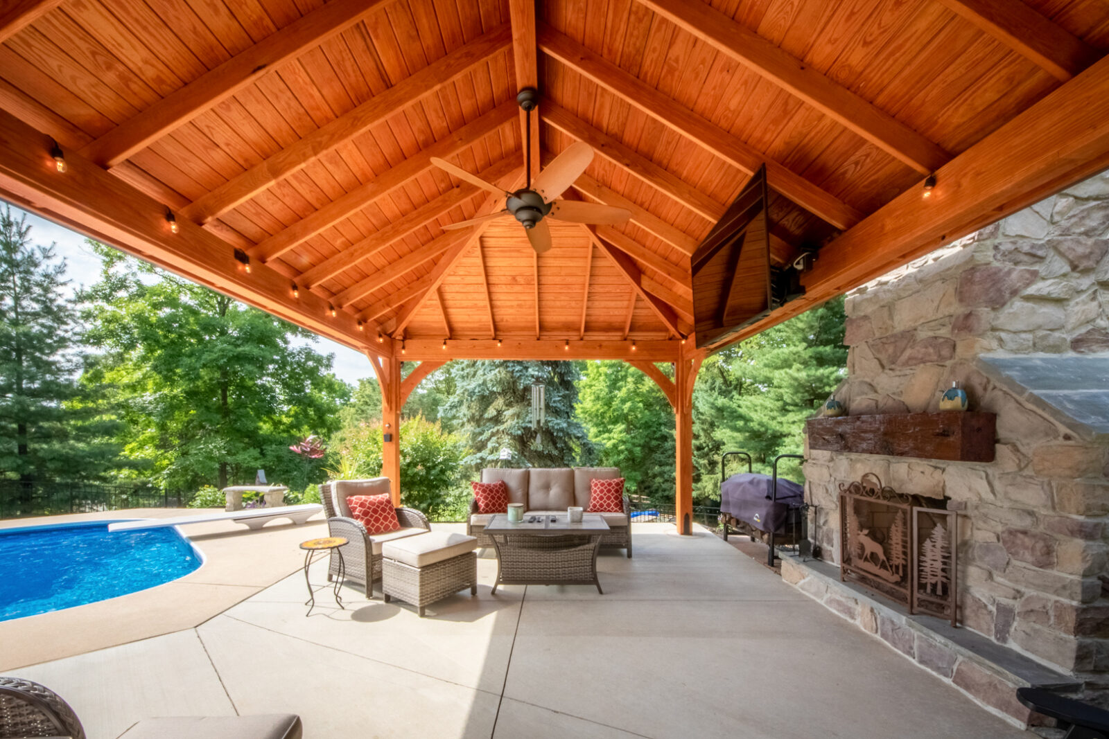 outdoor pavilion with dining room and fireplace