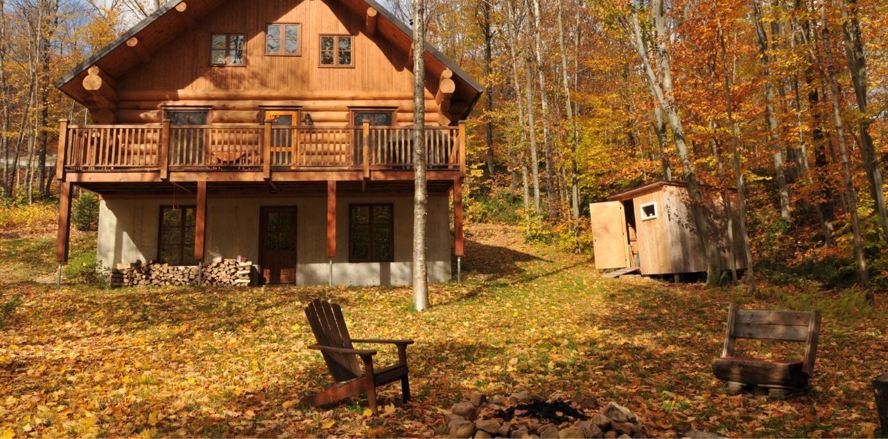 Cabin in woods with firepit
