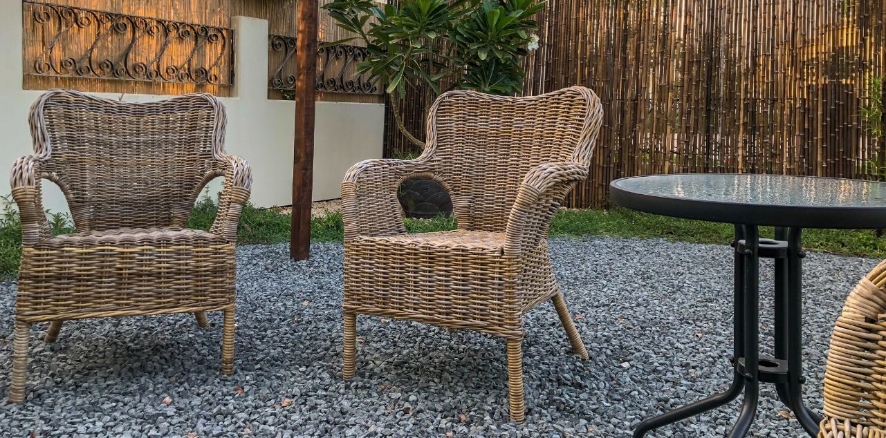 Wicker furniture on gravel patio