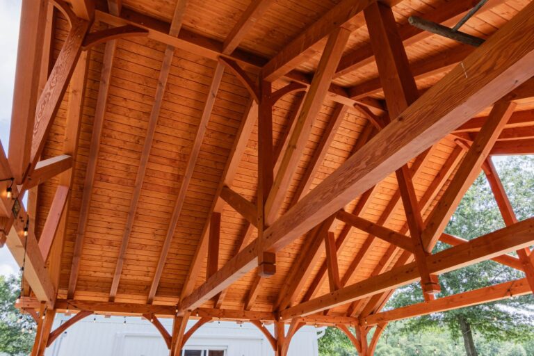 Inside ceiling of 38x30 Kingston Pro Timber Frame Pavilion. Light brown, orange tinted beans in sturdy pattern.