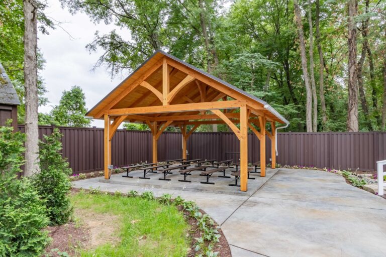 Front view of 20x24 Kingston Timber Frame Pavilion in garden_wooded area