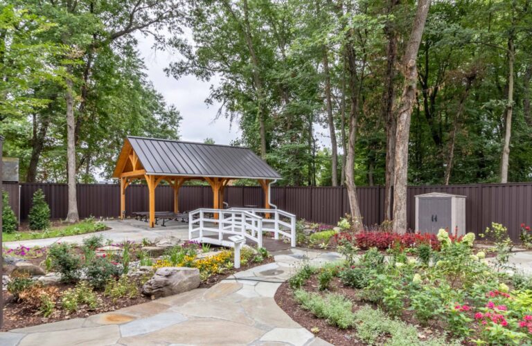 Far view of 20x24 Kingston Timber Frame Pavilion nestled in garden outdoor area 768x500 f50 50