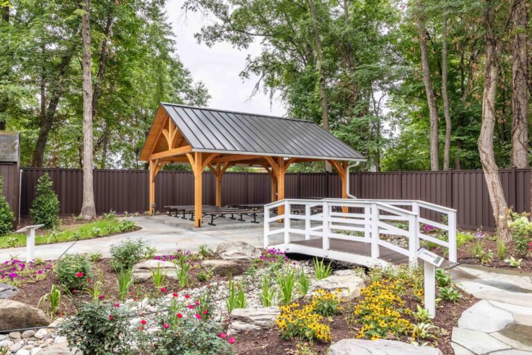 20x24 Kingston Timber Frame Pavilion Behind Bridge and Garden