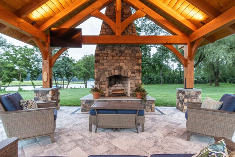TV, seating, and fireplace inside 18x20 Kingston Pro Timber Frame Pavilion