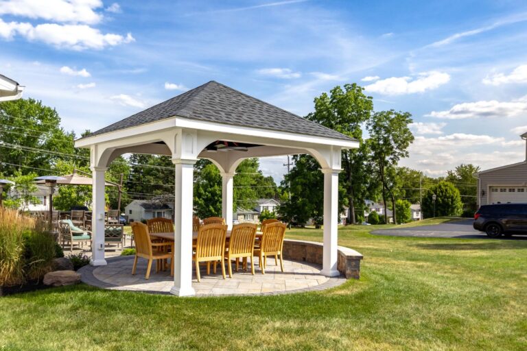 Full view of 12x12 Montford Vinyl Pavilion with seating area underneath