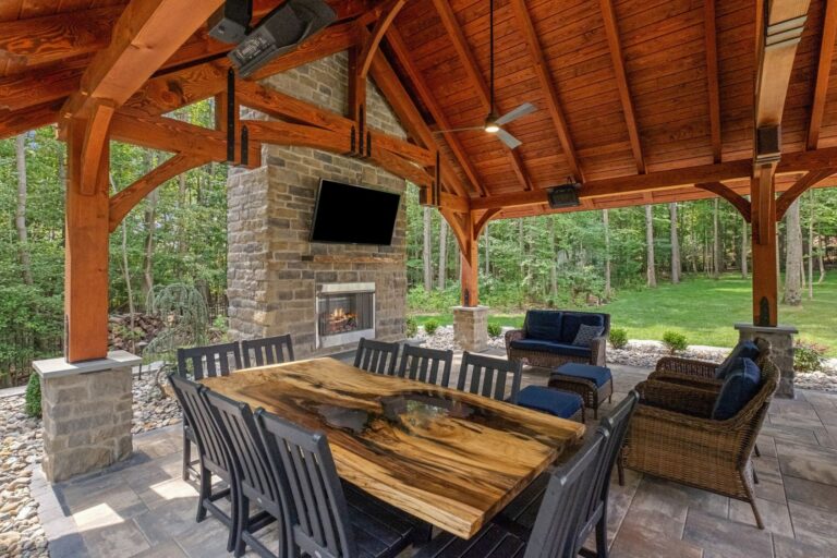 Table, TV and seating area inside 20x30 Grand Teton Timber Frame Pavilion in Pasadena MD