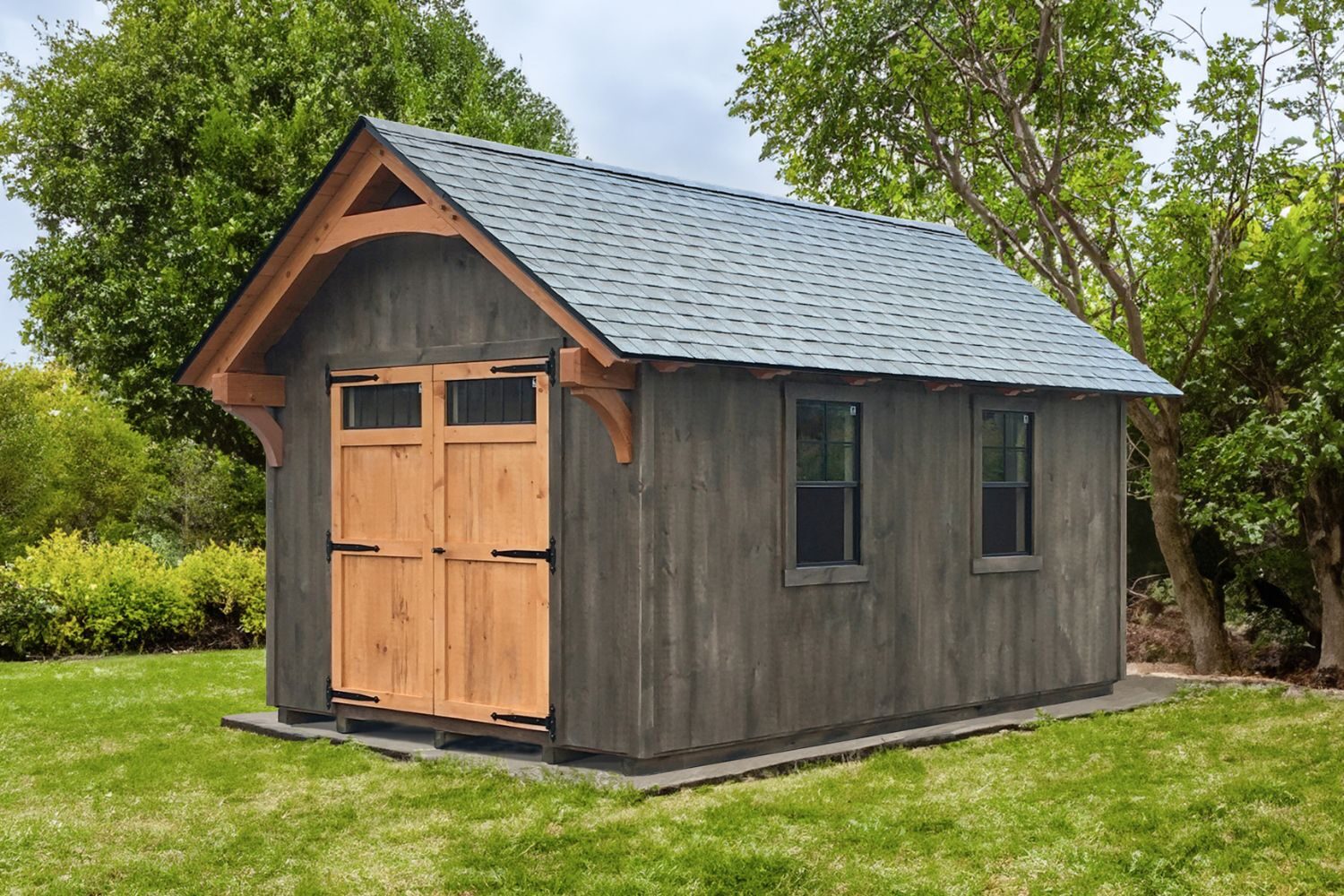 Lancaster Timber Frame Sheds in green yard with timber frame exterior overhand and double wooden doors