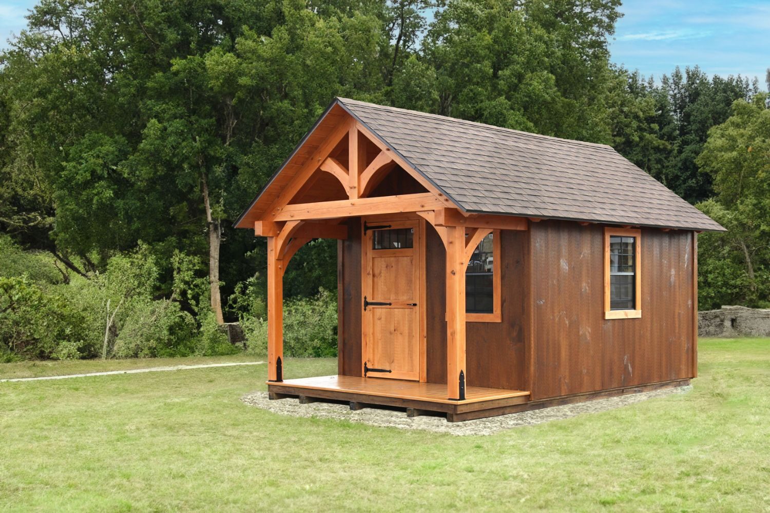 Brown Somerset Timber Frame Shed in grass field against trees