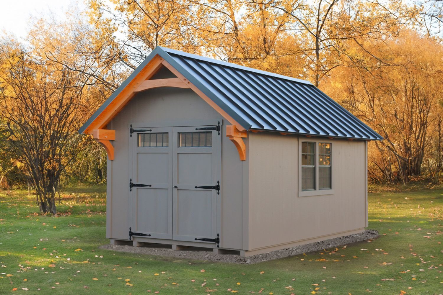 Grey Lancaster Timber Frame Shed against yellow trees with timber frame overhang and double doors