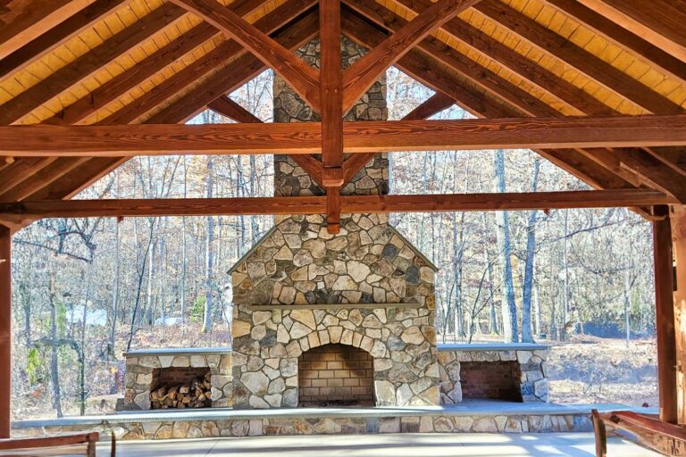 Front view of fireplace and timber framing inside pavilion
