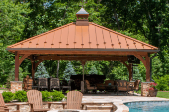 front of a beautiful wooden cheyenne garden pavilion in front of a pool for sale from Lancaster county backyard