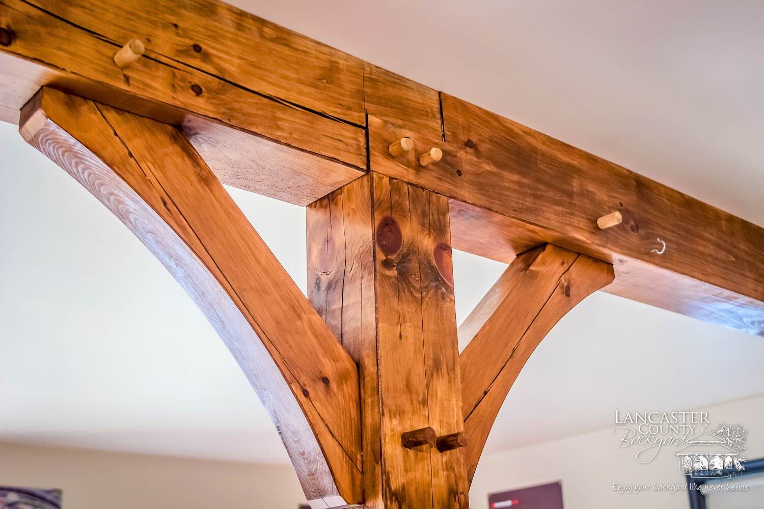 timber frame joint with view of wooden pegs
