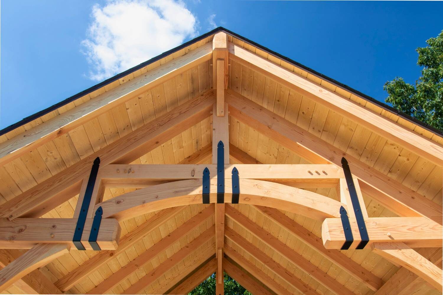 Close up of Arched Rib for Timber framing 101 guide with metal decorative elements