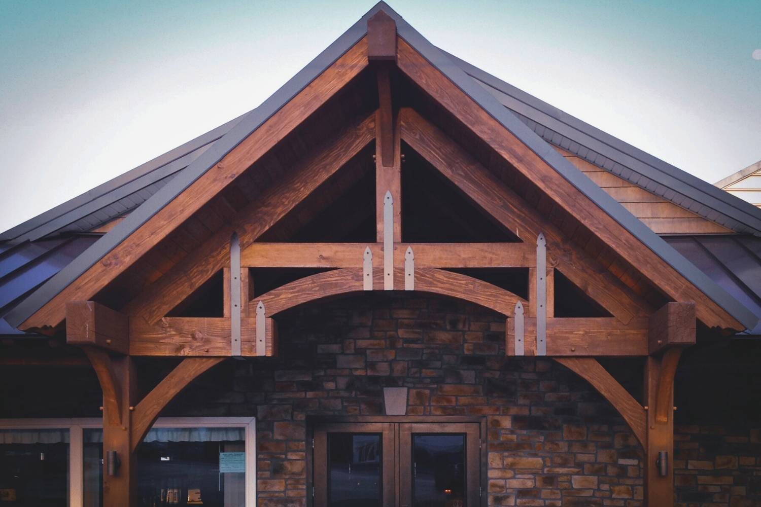Timber Frame Truss attached to stone building