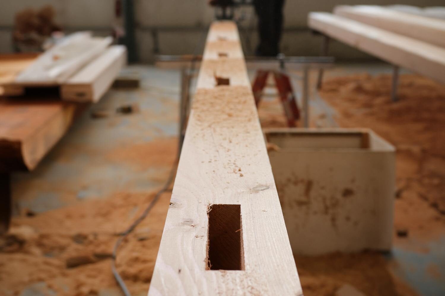 Timber frame timber after cnc timber framing process with holes for joints cut out