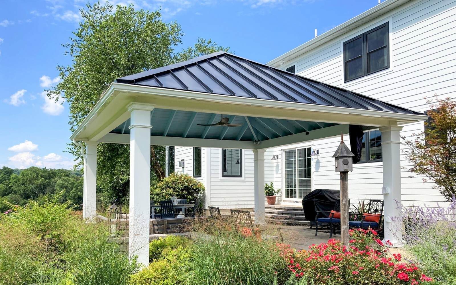 Outdoor living Pavilion and ornamental grasses outsides home