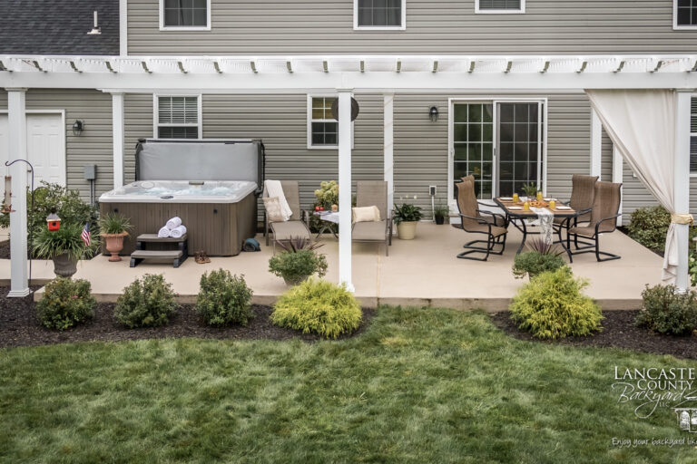 beautiful pergola with a hot tub