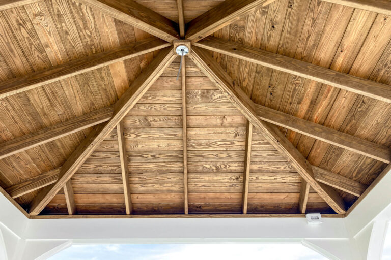 Exposed wood interior ceiling of pavilion with visible rafters and central support in Woolwich Township, NJ.
