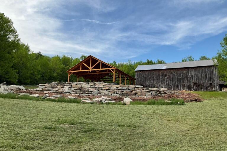 a 40x50 kingston timber frame pavilion in the distance in Delhi NY