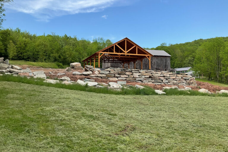 a 40x50 kingston timber frame pavilion in the distance in Delhi NY