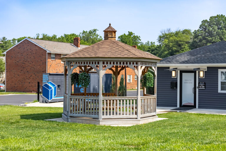 wooden gazebo close to buildings octagon.