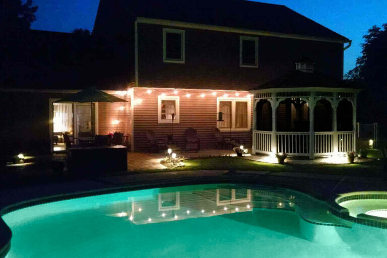 night scene of pool house gazebo