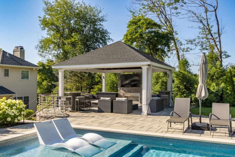 18x18 caribbean vinyl pavilion pictured from the front from across the pool