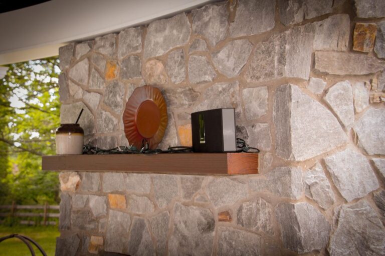 fireplace mantel of outdoor gazebo pavilion by poolhouse