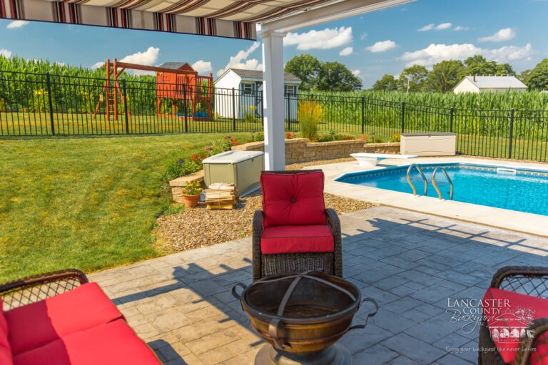 furniture inside poolside pergola