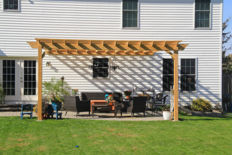 wooden pergola attached to house