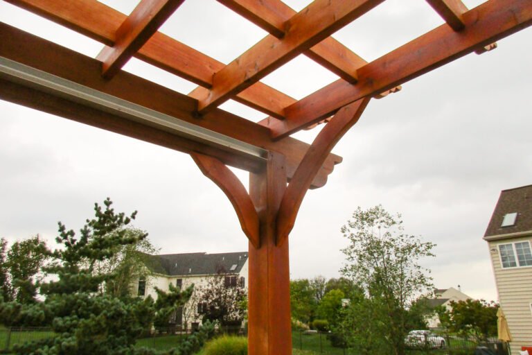 edge of a wooden backyard pergola