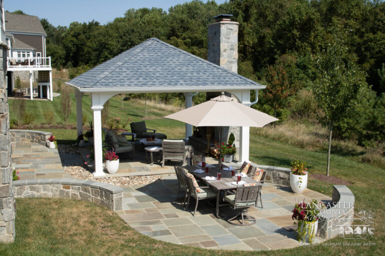 16x18 vinyl montford pavilion over a patio with a fireplace