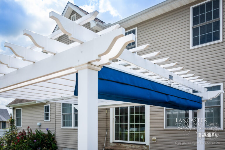 vinyl pergola with a blue shade canopy