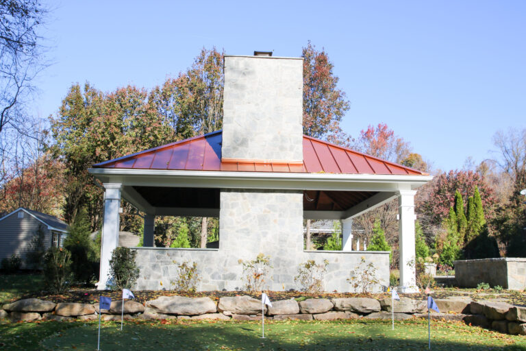 carbbean vinyl outdoor pavilion with a fireplace