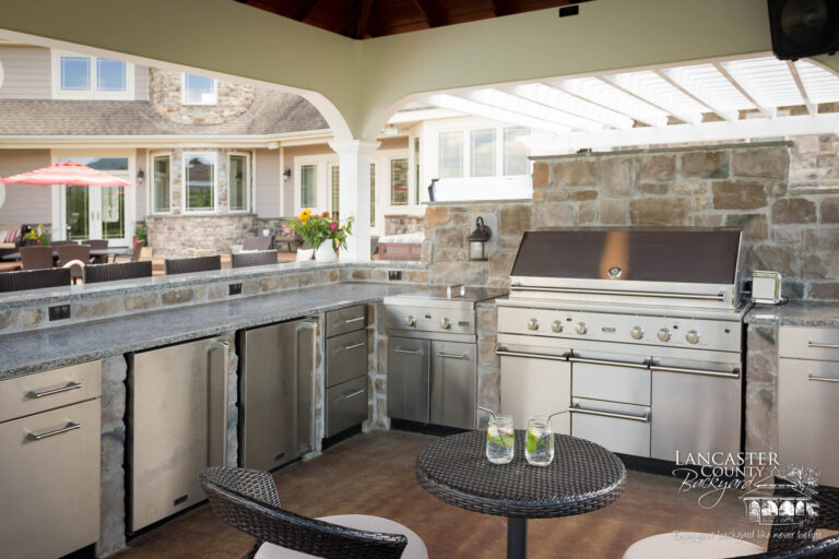 pergola and pavilion with an and outdoor kitchen