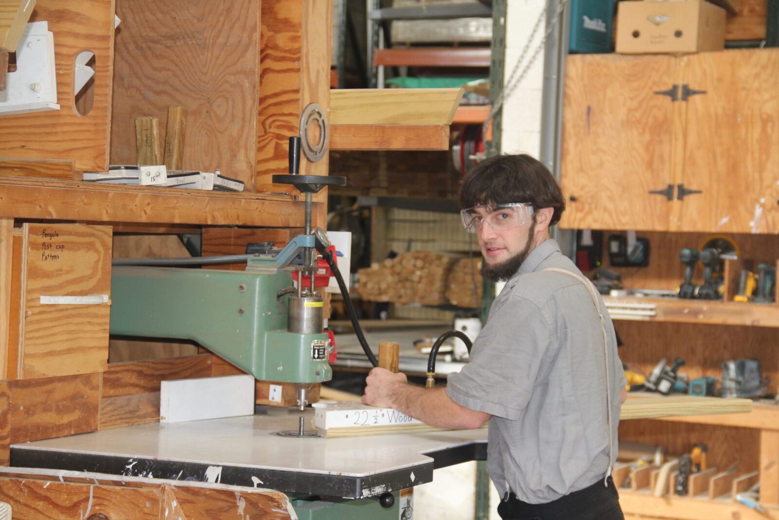 amish carpenter working on an amish pavilion