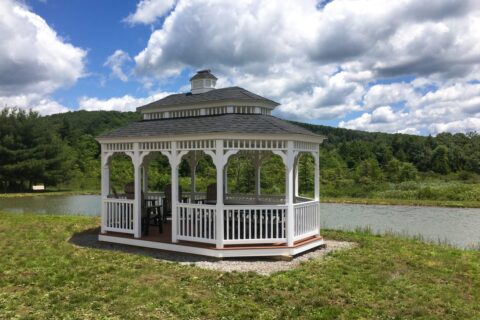 An Irresistible Permanent Gazebo By The Lake At The Backyard