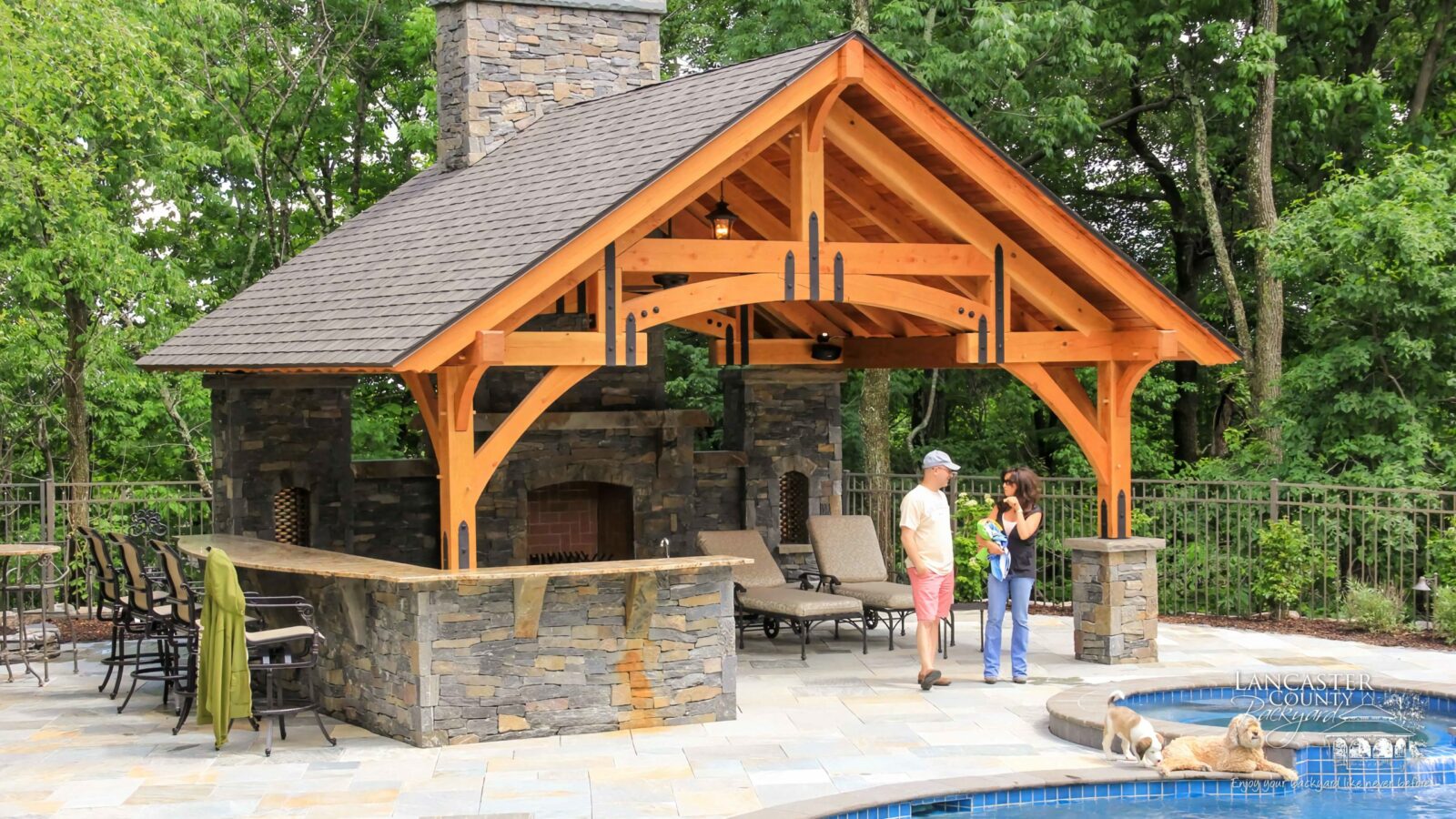 grand teton timber frame pavilion with a fireplace