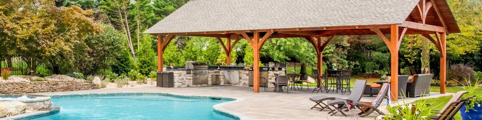 https://lancastercountybackyard.b-cdn.net/wp-content/uploads/fly-images/17792/Outdoor-Kitchen-Pavilion-with-pool-1-scaled-1600x400-c.jpg