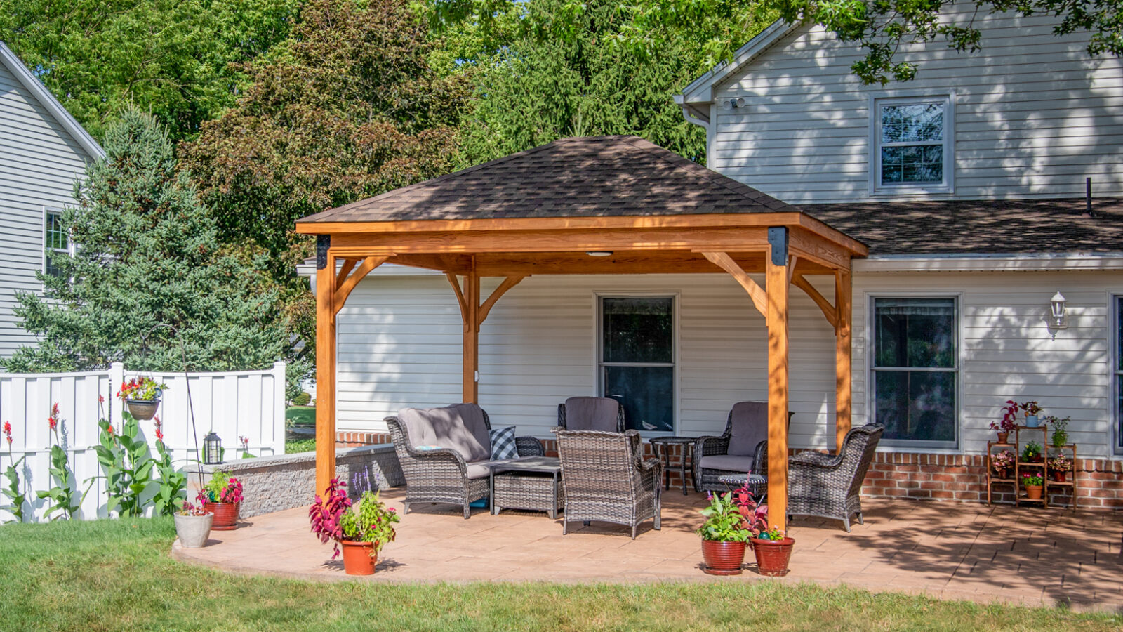 12x14 lakefront hip roof pavilion with outdoor furniture