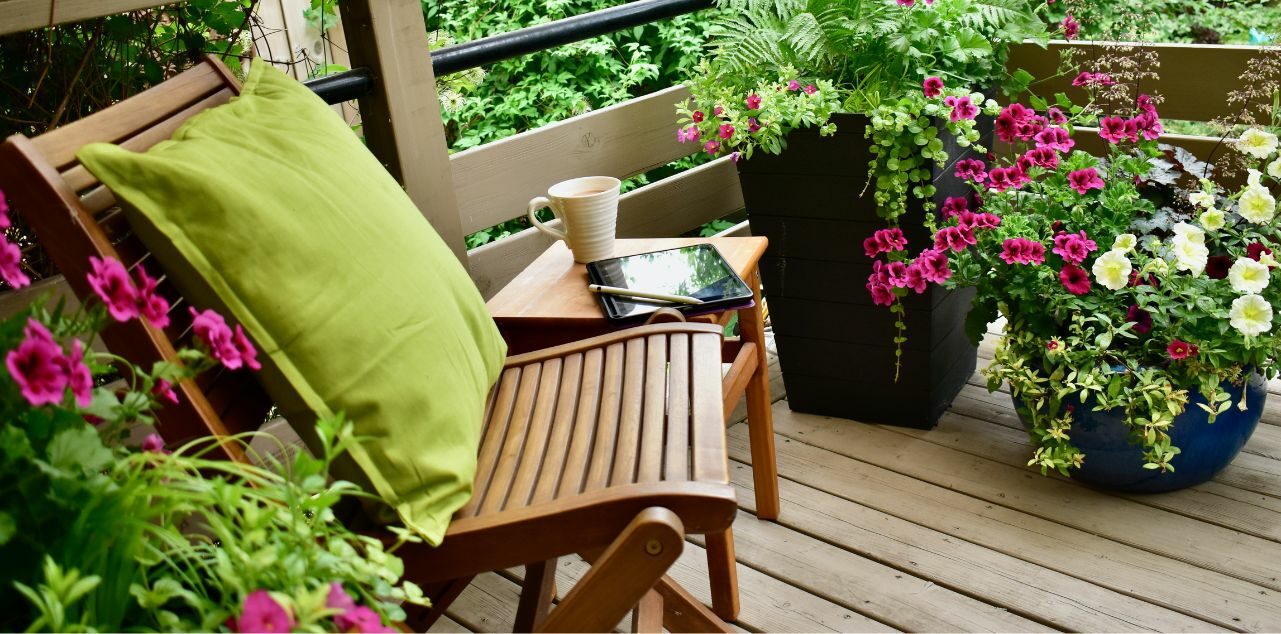 Outdoor chair on patio surrounded by plants