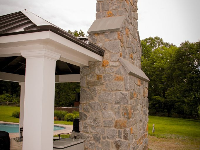 chimney idea of poolhouse pavilion design with fireplace by amish builders in lancaster pa