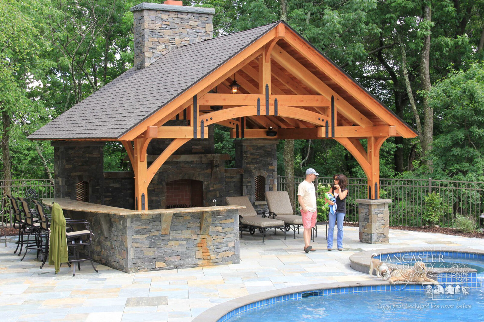 outdoor timber frame pavilion by a pool