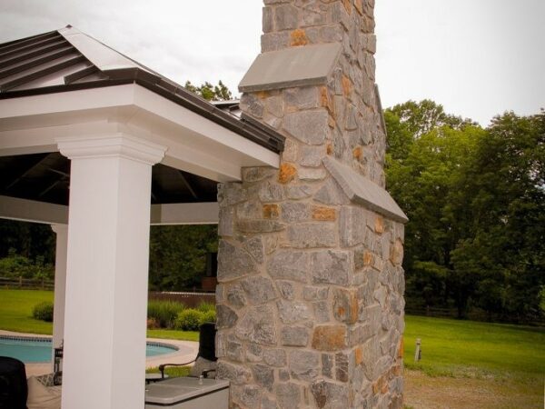 chimney in outdoor fireplace under pavilion
